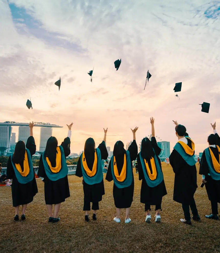 University graduates celebrating outdoors